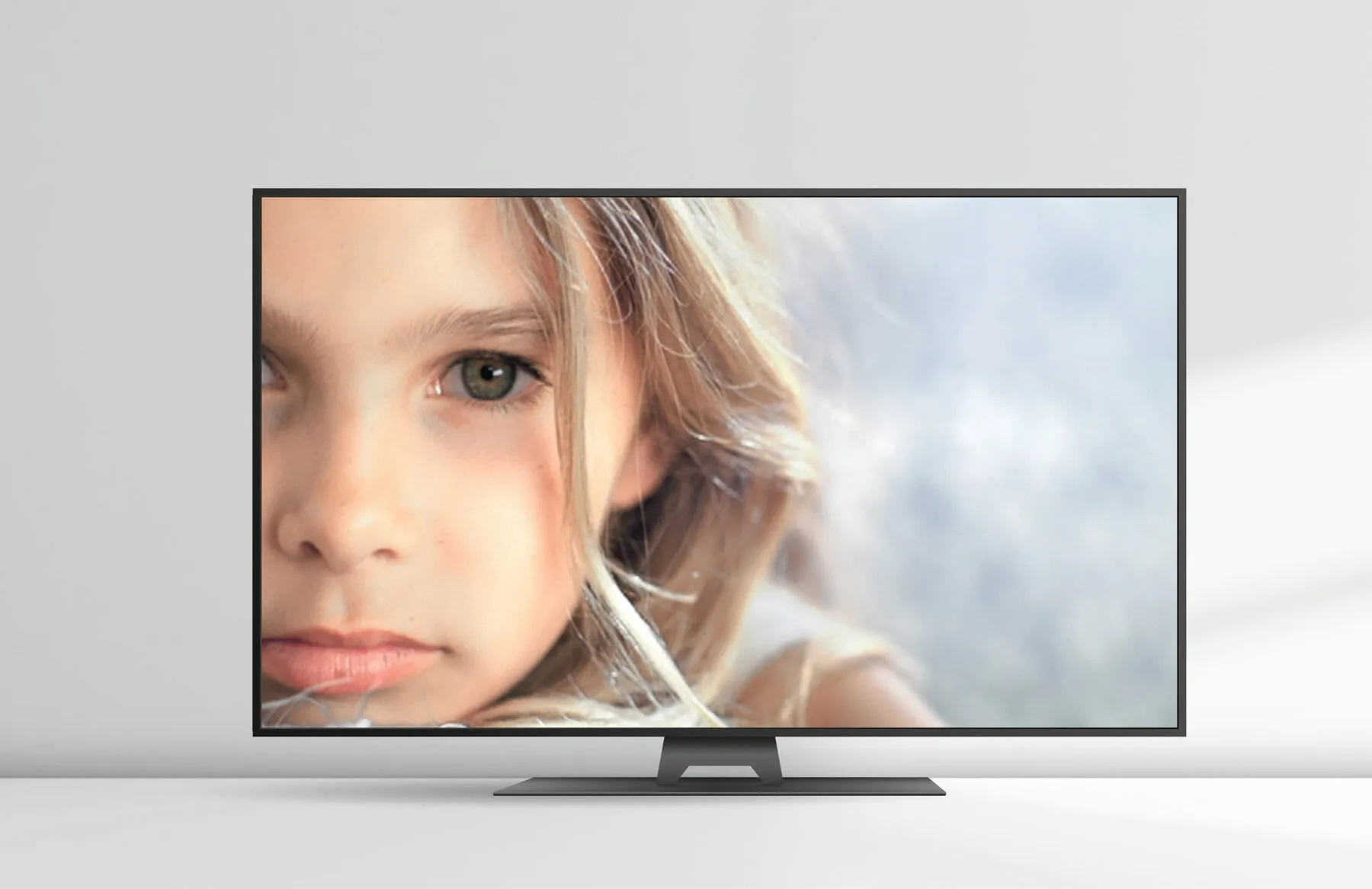 A Hitachi television showing a child’s face