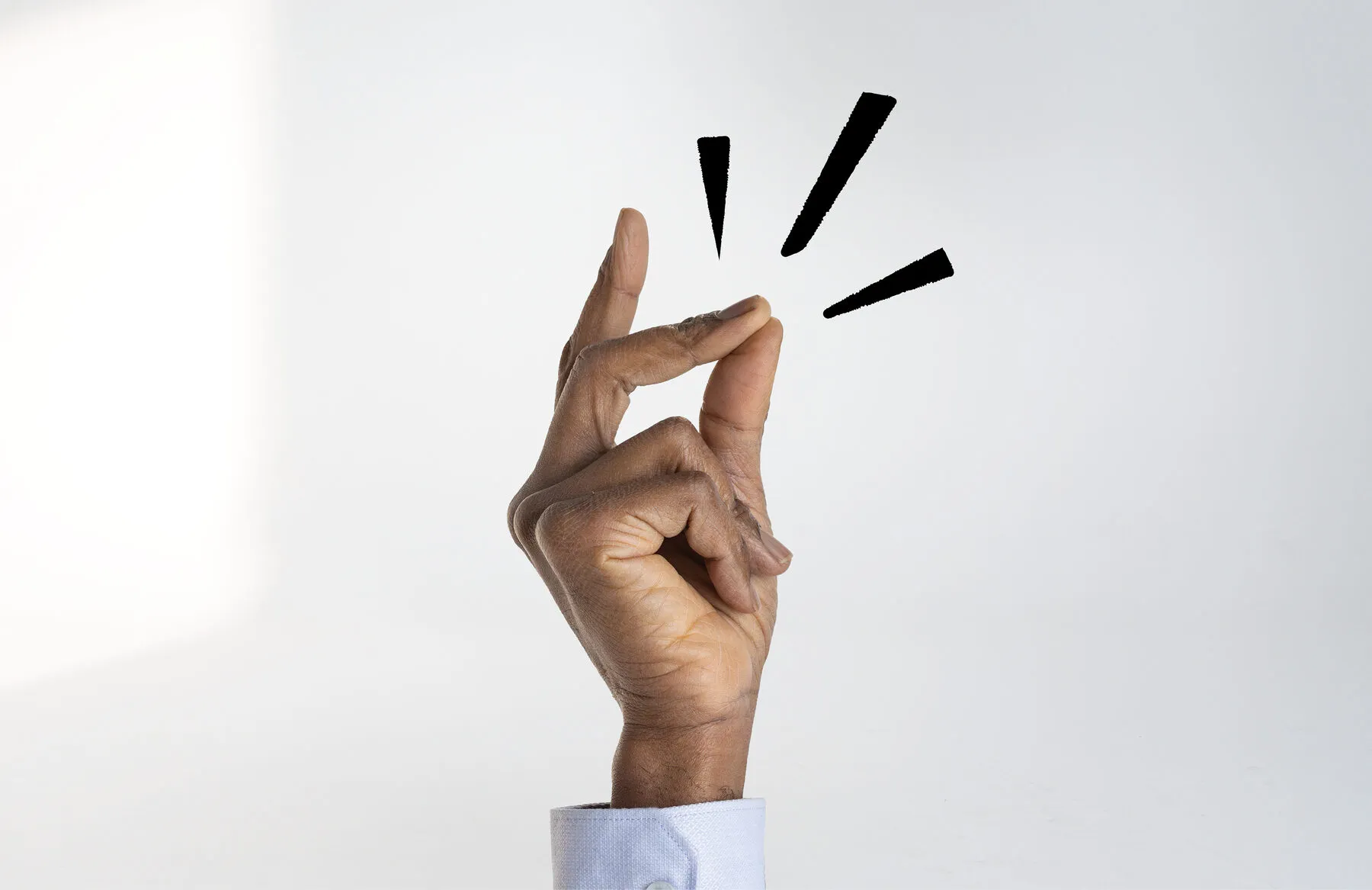 A hand making the ‘Switch on’ finger-click gesture with motion marks