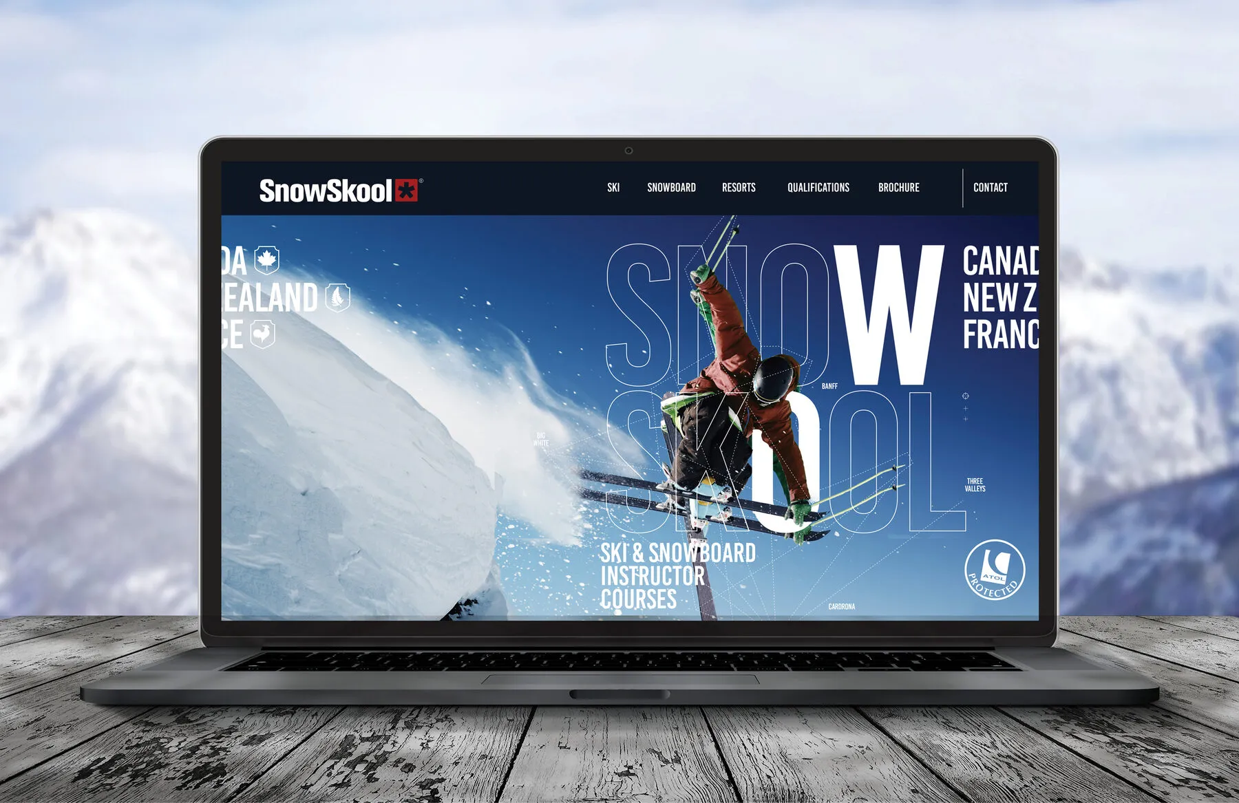The SnowSkool website shown on a laptop