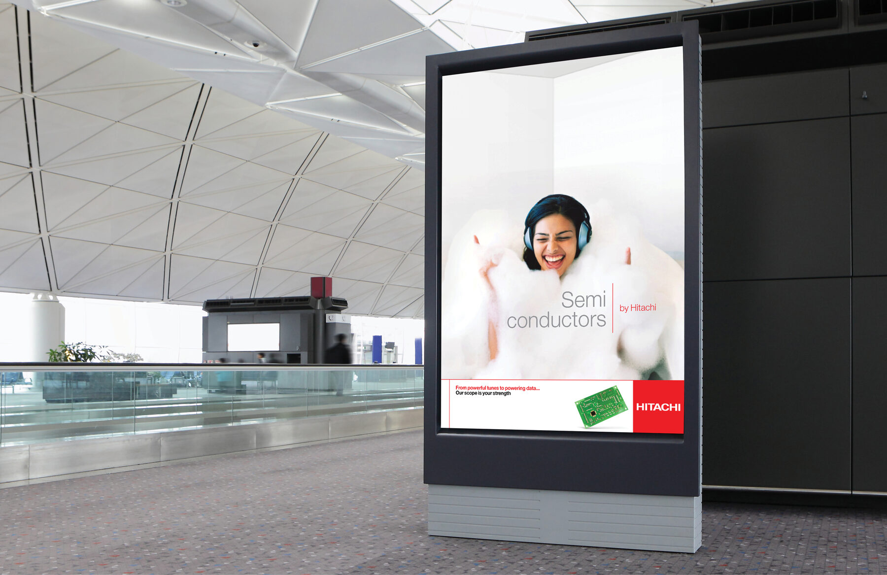 ‘Semi conductors by Hitachi’ billboard in an airport