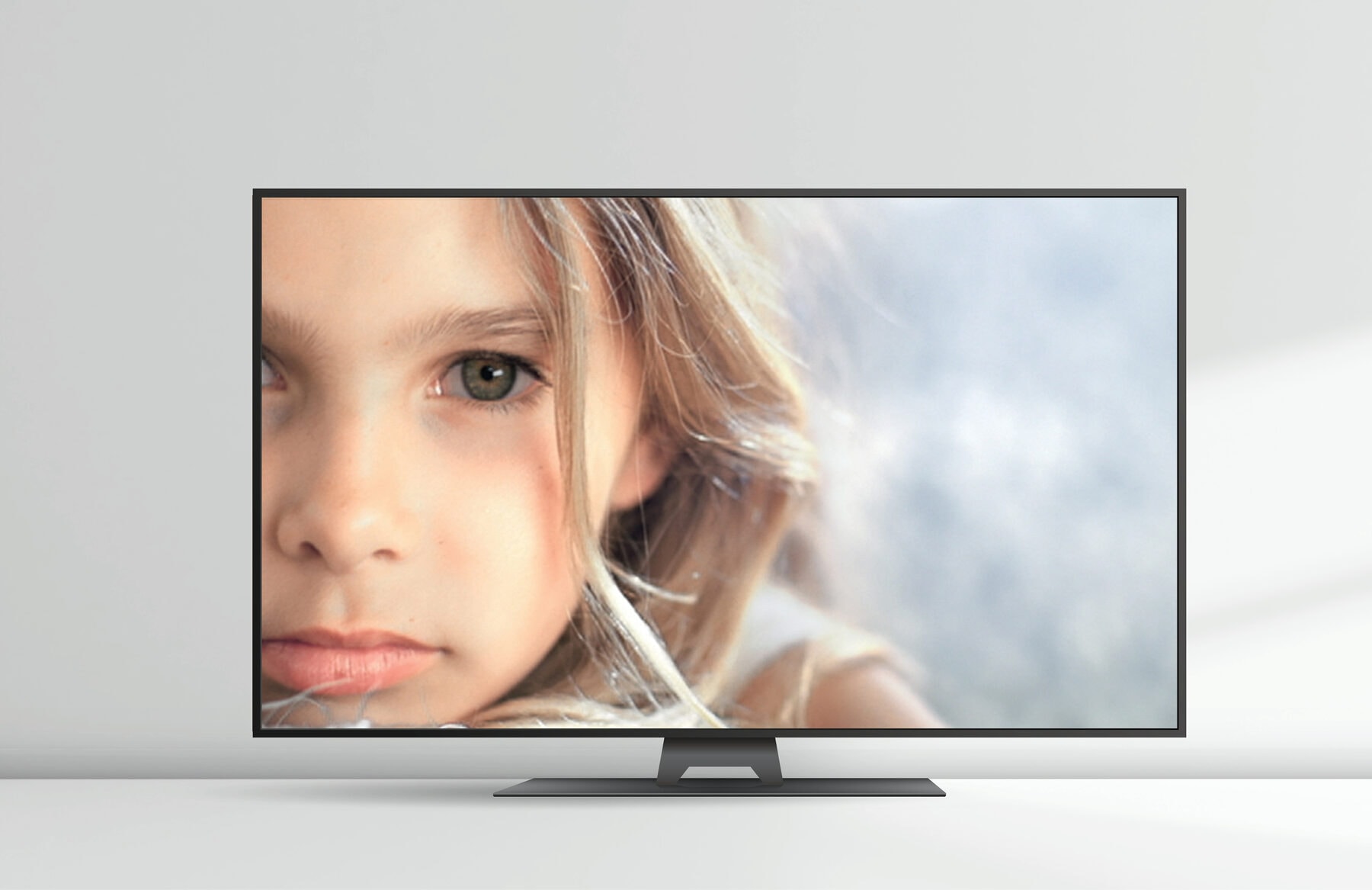 A Hitachi television showing a child’s face