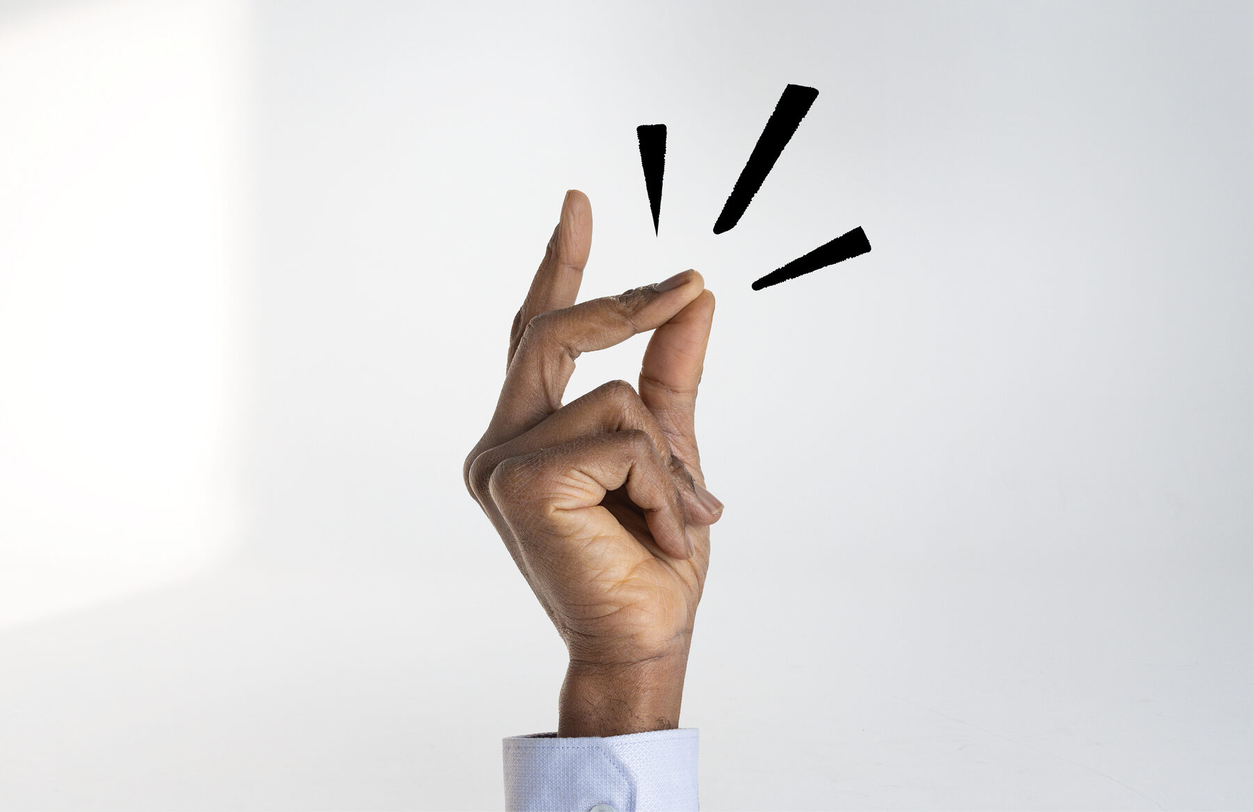 A hand making the ‘Switch on’ finger-click gesture with motion marks