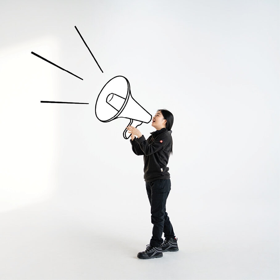 A worker holding a megaphone