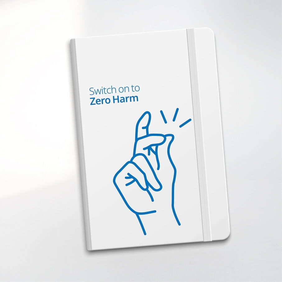 A notebook with the Switch on to Zero Harm finger-click illustration