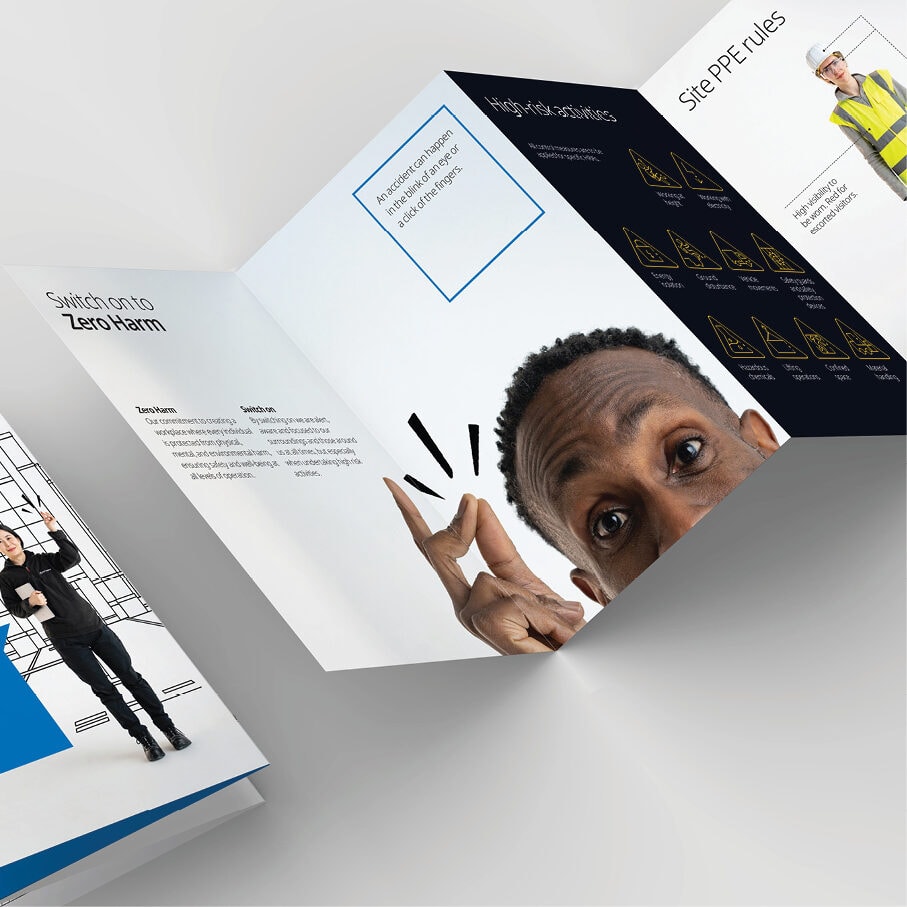 A trifold safety brochure with a person peeking through